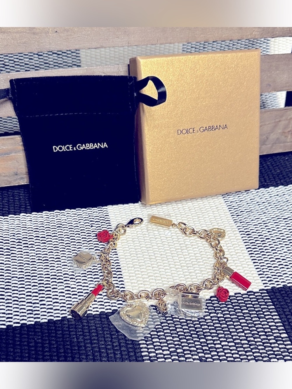 Dolce & Gabbana Gold Charm Bracelet with Red Accents